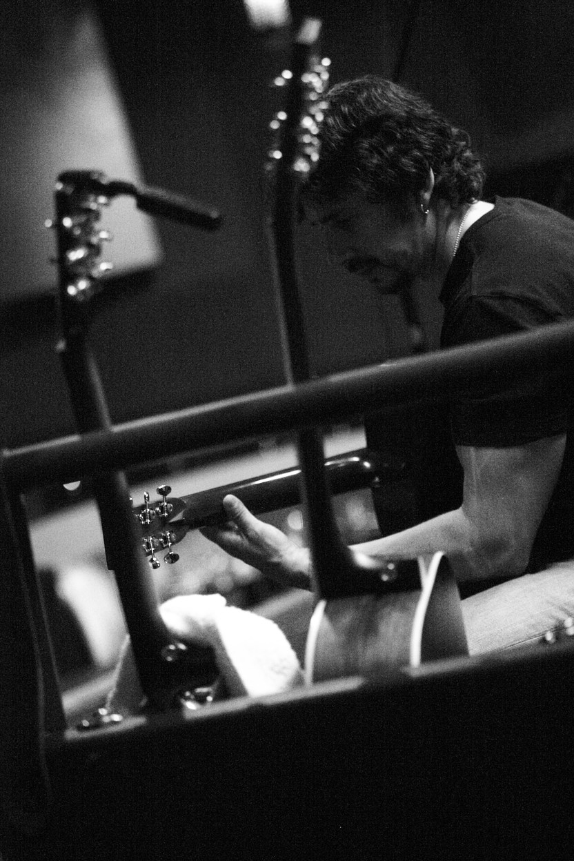Roman Morykit working with a guitar in the studio